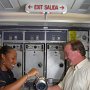 APRIL – Honorable Mention - Service with a Smile at 37,000 feet<br />John Rankin, Local Lodge 2339H, Continental Airlines, Houston, TX<br />Flight Attendant LeKisha Hartmann pours a cup of coffee for passenger Ron Campbell.<br />